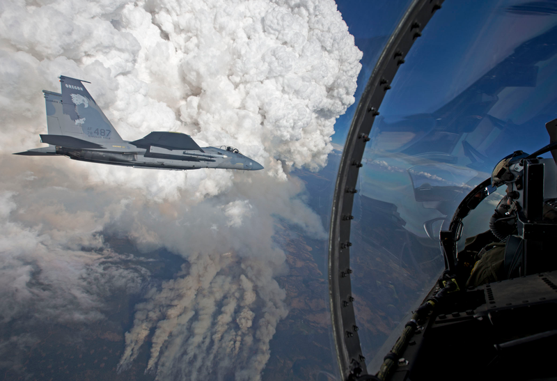 Illustration for article titled These Photos Of F-15s Flying Near Towering Forest Fires Are Totally Nuts